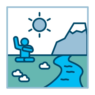 A person in a landscape of grass, water and a mountain. 