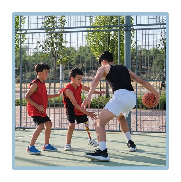 3 people playing basketball. 
