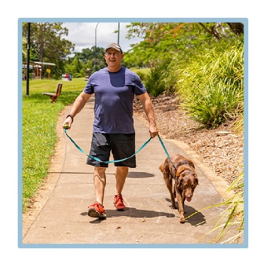 A person walking their dog. 