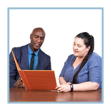 A person supporting someone to read. 