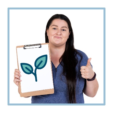 A person holding a clipboard with 2 leaves on it. They are also giving a thumbs up. 