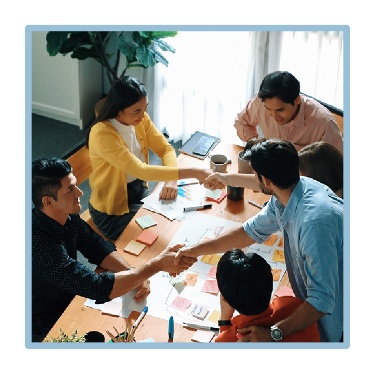 A group of people in a meeting. 