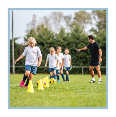 A group of children playing sport. 